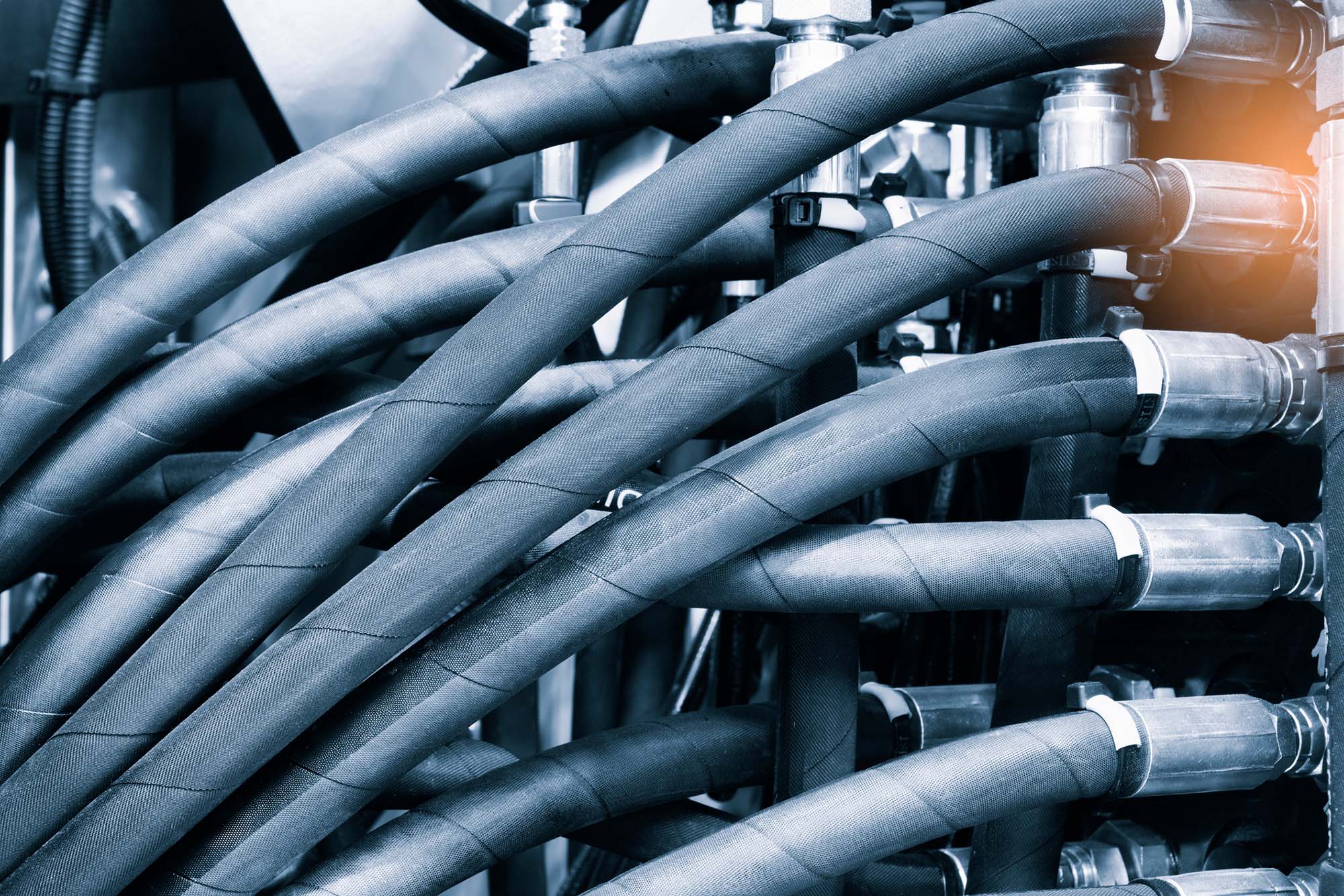 industrial High pressure hydraulic hose system connected to steel pipes